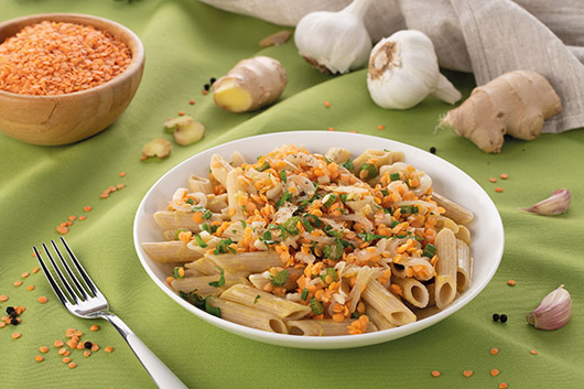 Penne integrali risottate con lenticchie e peperoni e zenzero ricetta